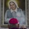 Raul Biord Castillo, archbishop of the Archdiocese of Caracas, stands in front of a painting depicting nun Carmen Elena Rendiles Martinez in Caracas on March 31, 2025. Pope Francis approved the canonization of Carmen Elena Rendiles Martinez, becoming the second Venezuelan saint after the sainthood of doctor Jose Gregorio Hernandez was announced last February. (Photo by Pedro MATTEY / AFP)